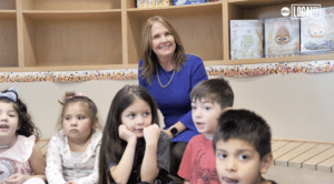 Carol Nelson poses with a group of students.