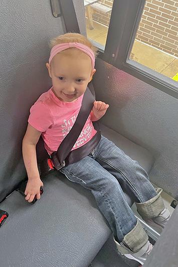 Olivia taking a ride on the bus.