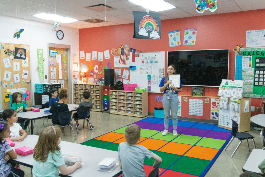 Students getting instruction from teacher.