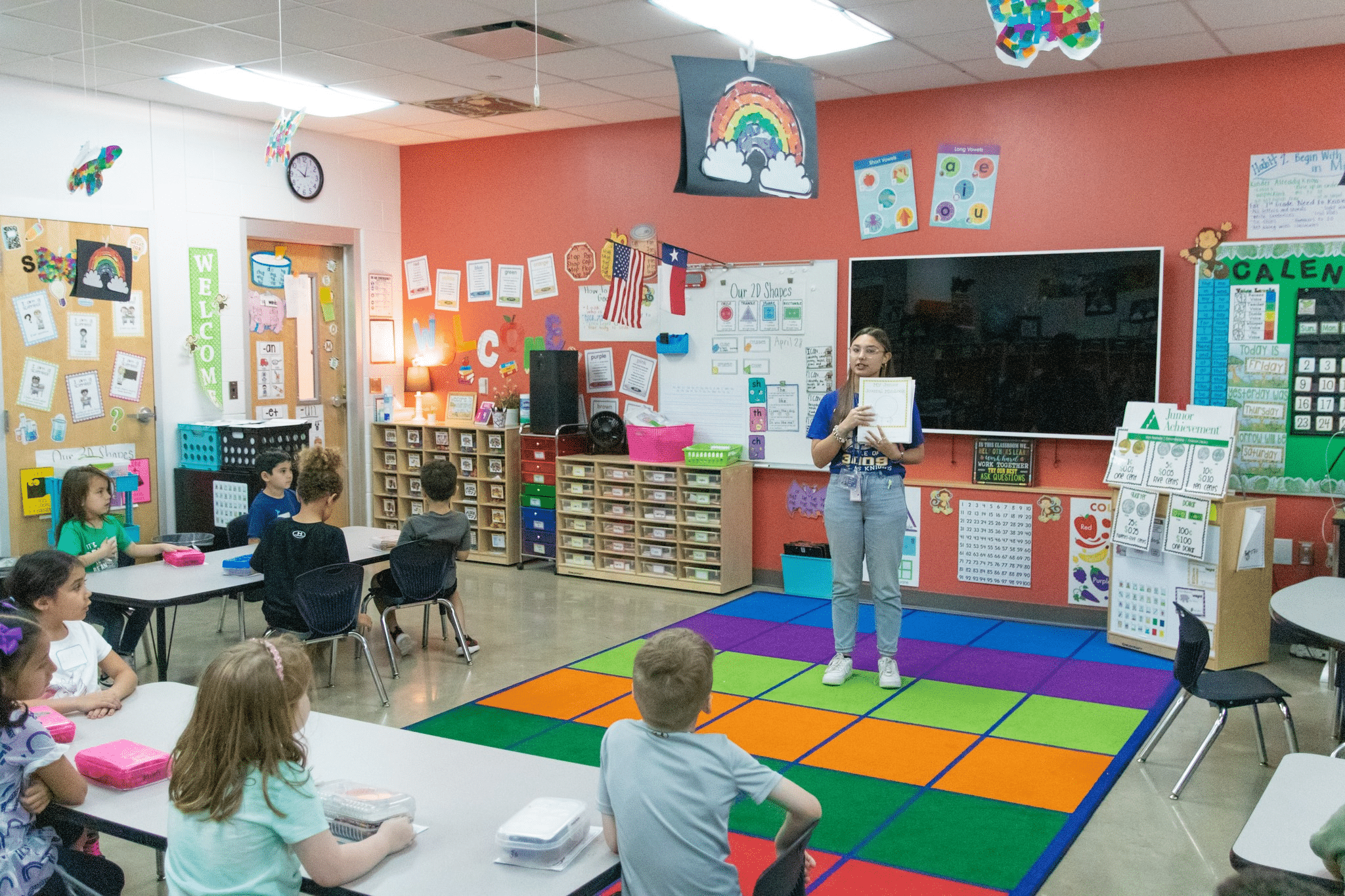 Students getting instruction from teacher.