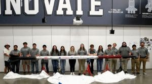 Brazosport ISD Brazoswood High School Goddard Team holding Phoenix 1 Rocket