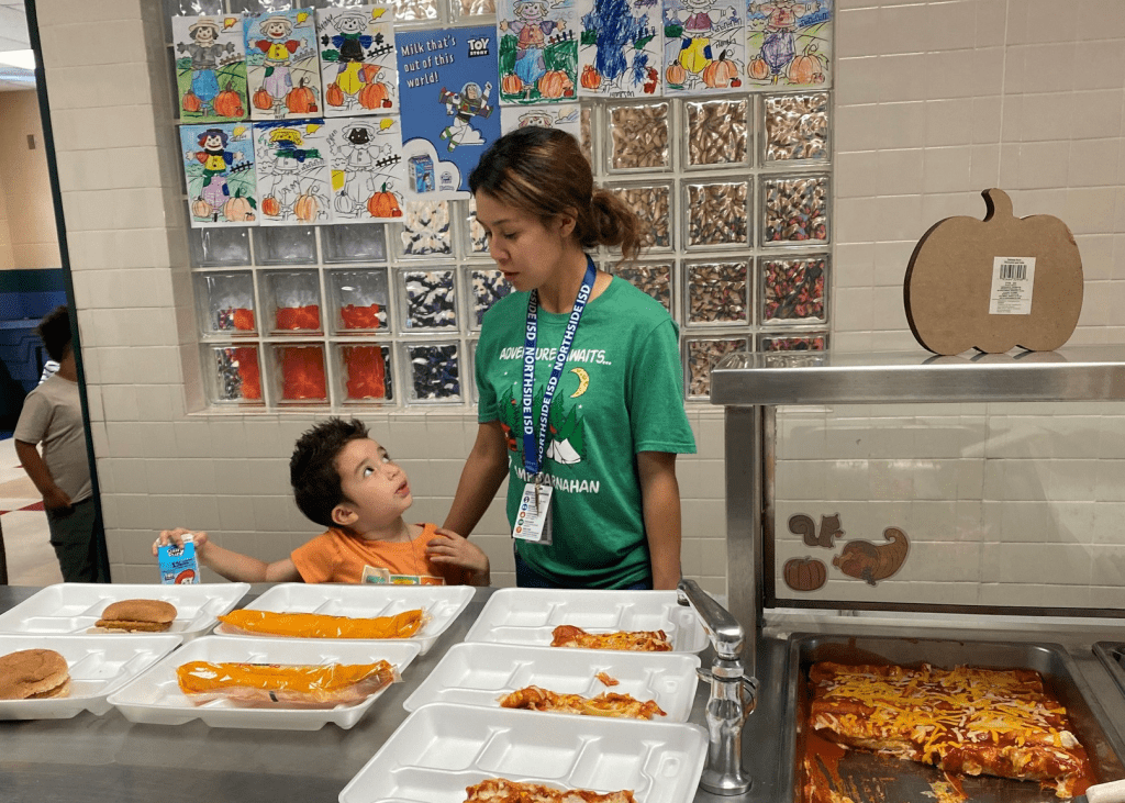 NISD student waits to try new food