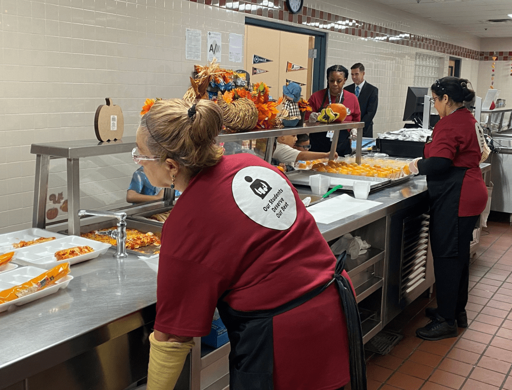 NISD kitchen staff preps food for News4SA reporter