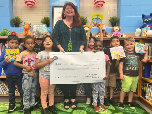 Valley Hi students pose with check from Laura Bush Foundation