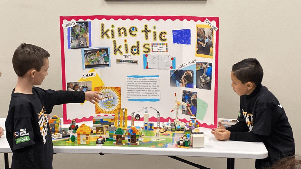Wortham Oaks students look over lego poster