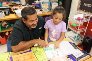 Judson Franz Leadership Academy parent and student look over data