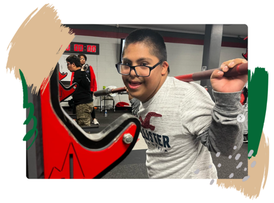 A member of the Judson ISD Special Olympics team lifts weights.