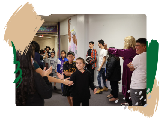 San Antonio ISD children high five community members.