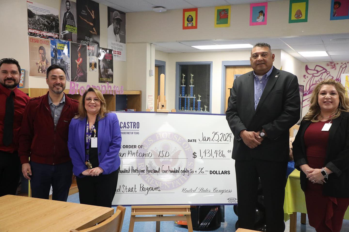 congressman presenting funding to administrators