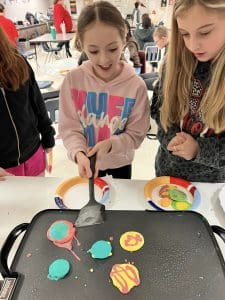 Huffman ISD Art students making pancake art
