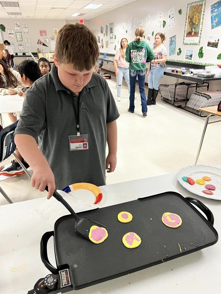 boy making pancake art