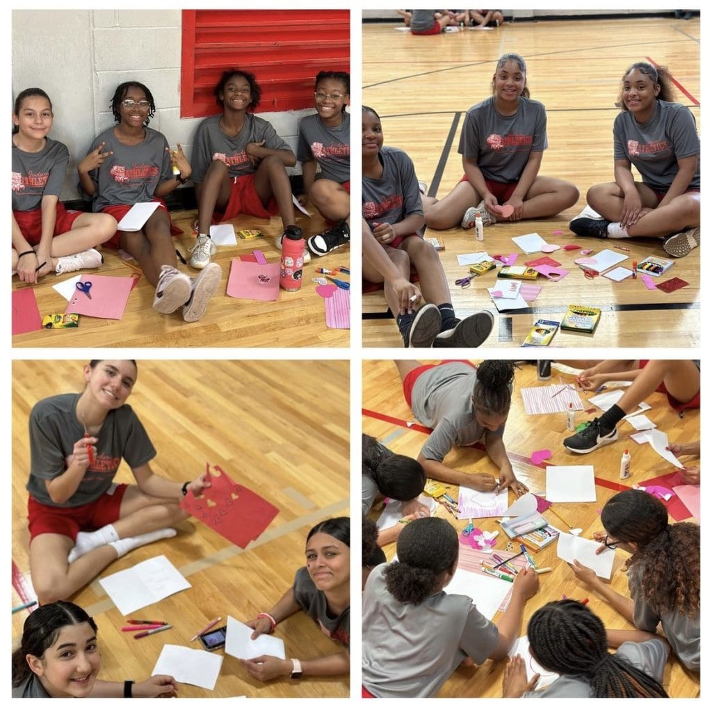 Athletes making valentines for service members