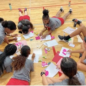 Athletes working on valentines