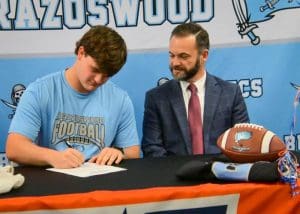 Warren signing national letter of intent for football