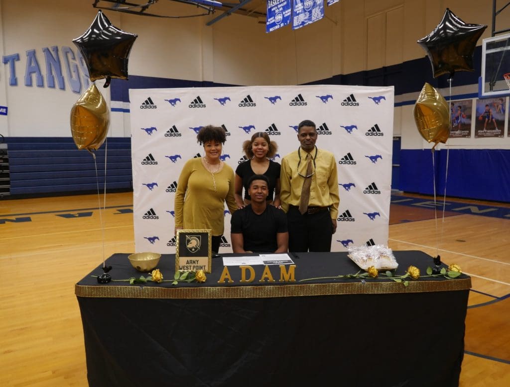 Student and family for signing day