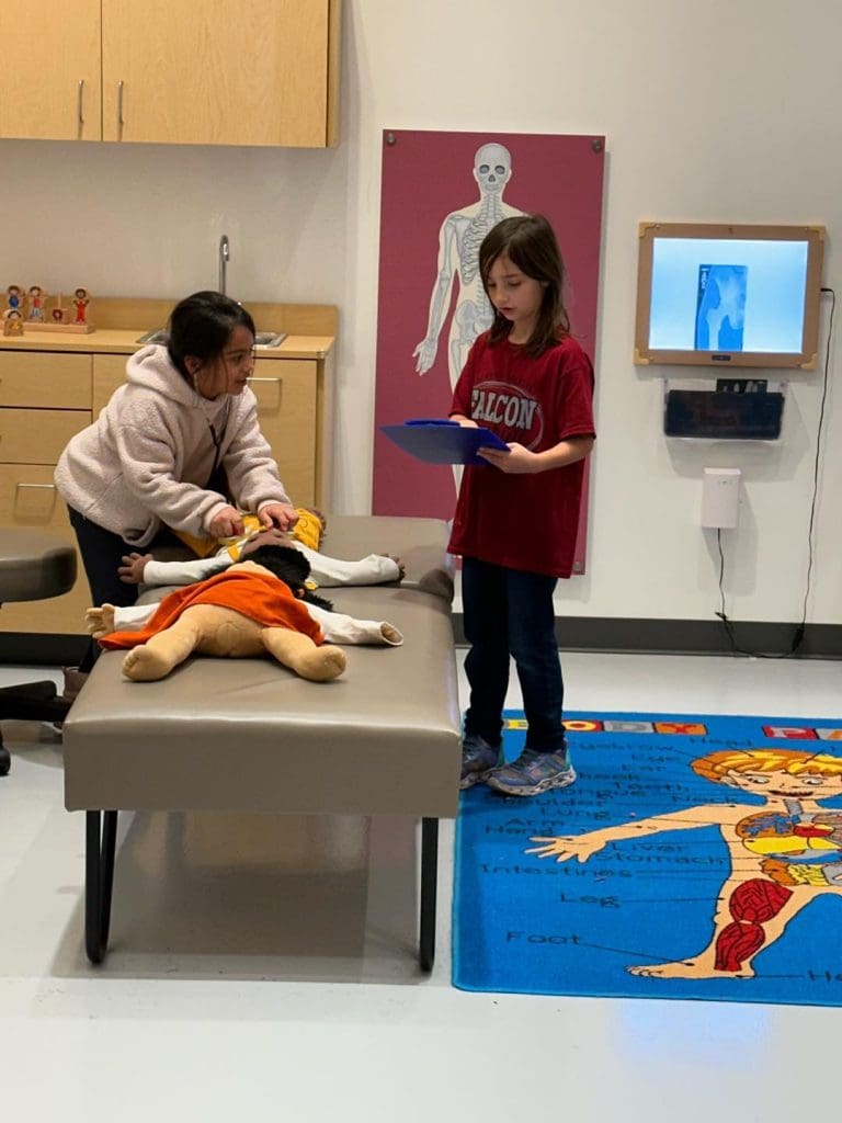 huffman student playing doctor childrens meseum