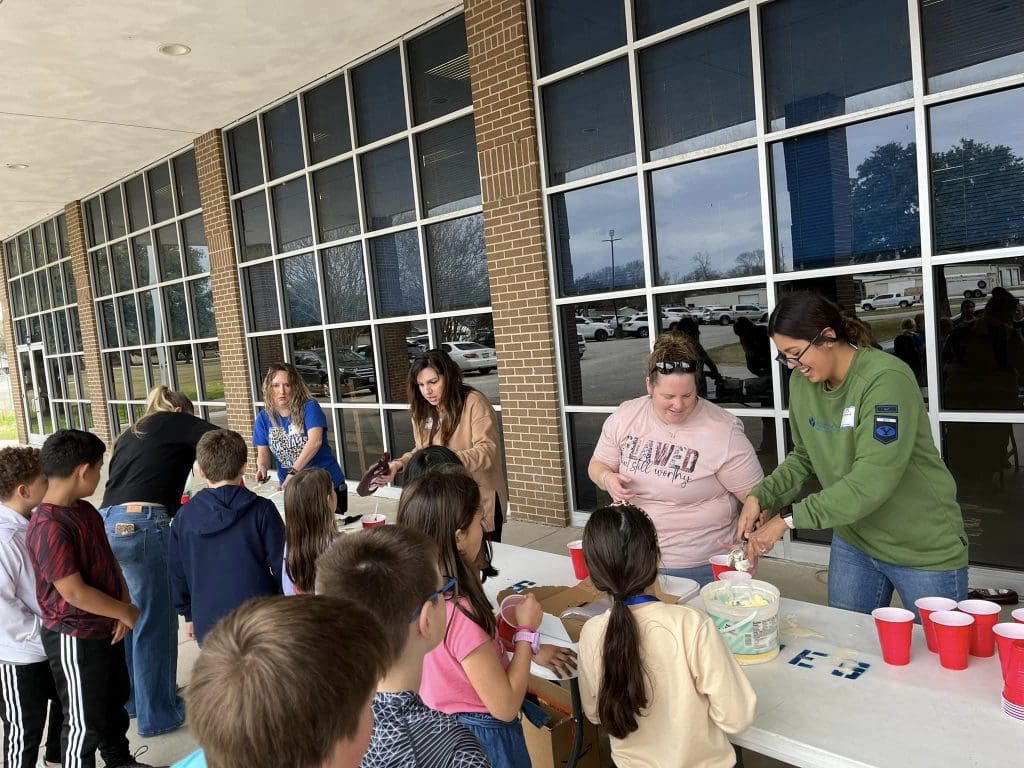 PTA handing out ice cream to students