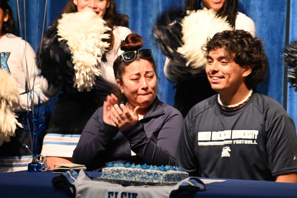 Emotional Picture of mother and son on signing day