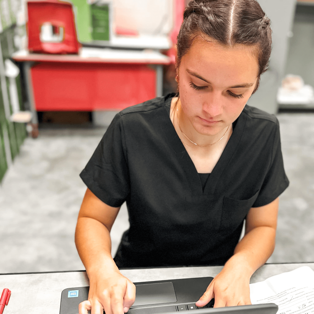 Crosby High School Nurse student checking laptop