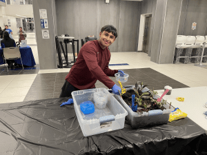 Student presenting plant exhibit