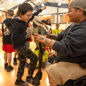 Students learning about disabilities in gym