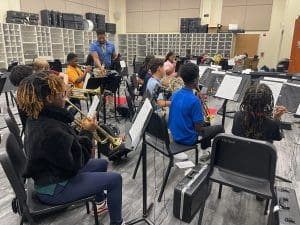 Forney ISD students participating in music education while playing instruments