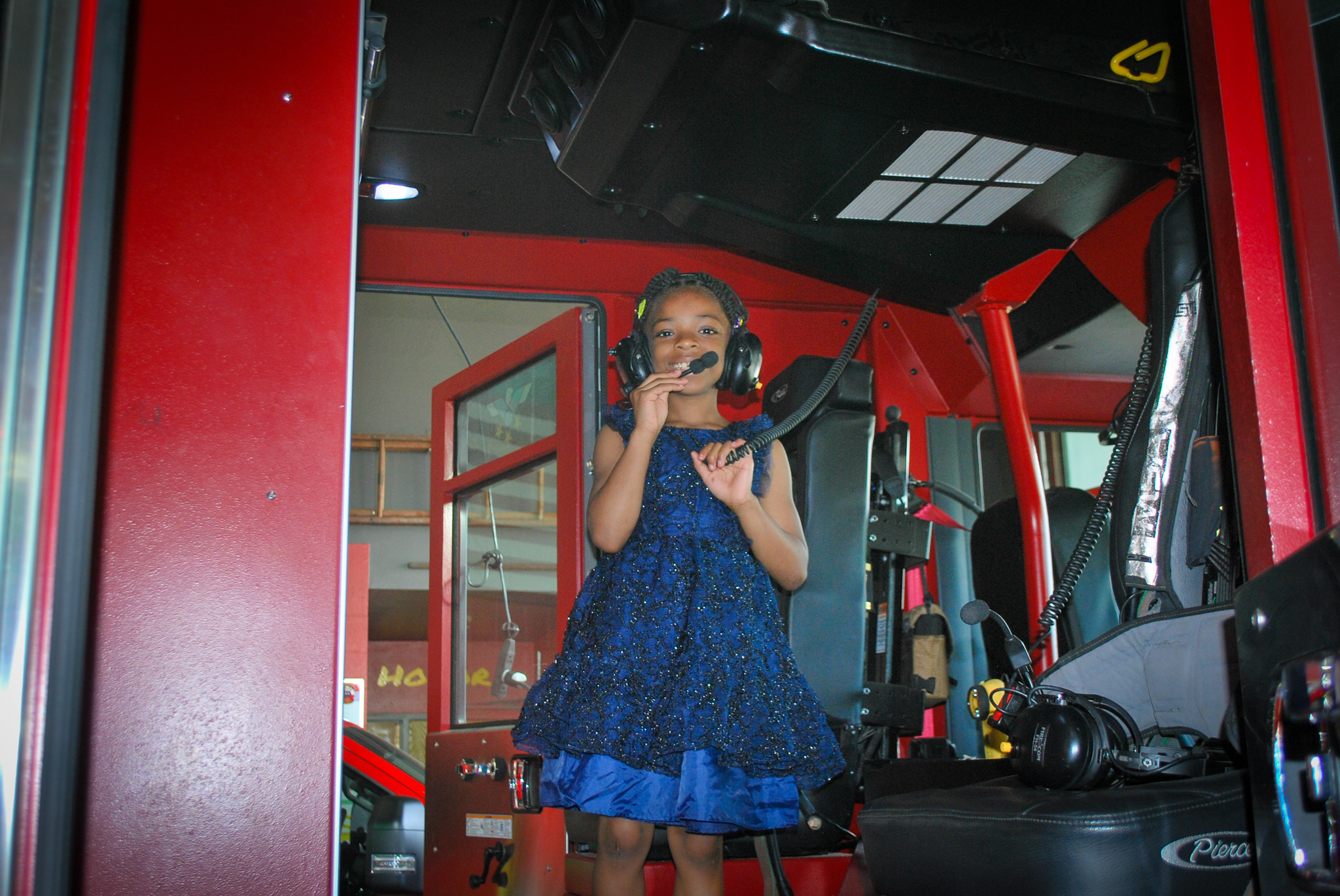 Gainesville student playing in fire truck