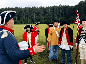 Historical reenactors in Revolutionary War uniforms