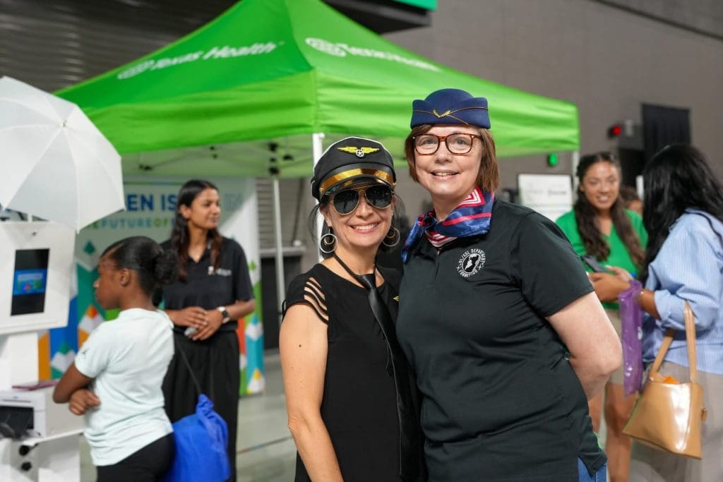 Two staff members in flight attendant attire