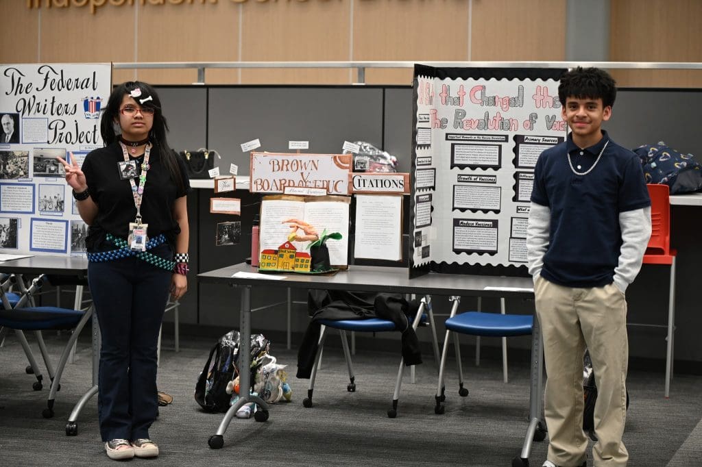 Alief students at their presentation tables