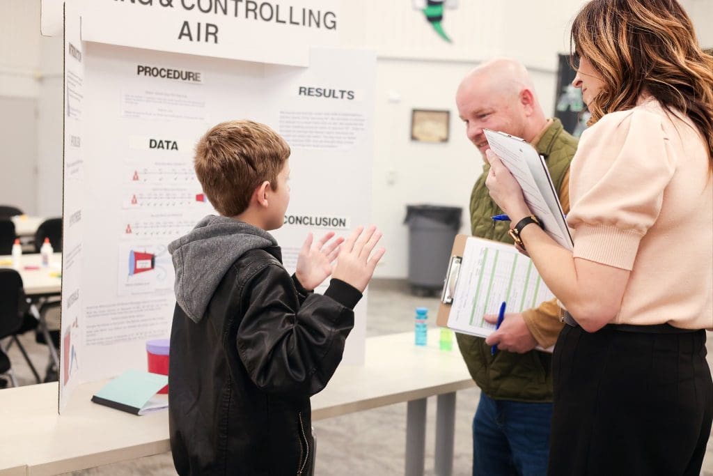 Azle student explaining experiment