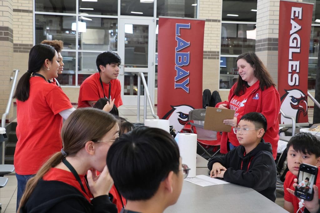 Cypress-Fairbanks students talking with faculty
