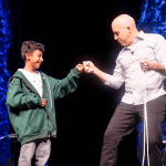 Corsicana student and Bill Blagg fist bump after performing a demonstration