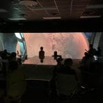 Forney ISD students looking at planet