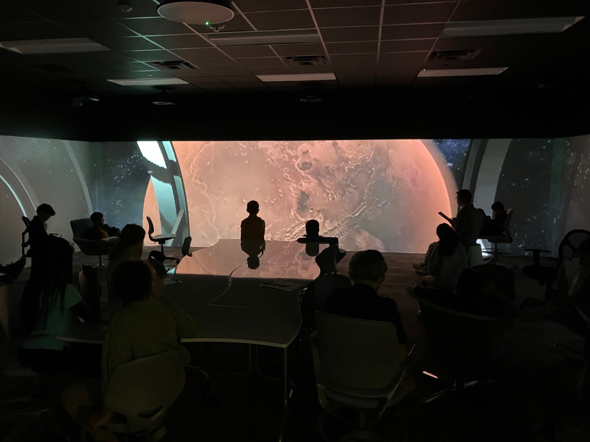 Forney ISD students looking at planet